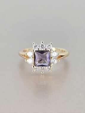 Gold Ring with Purple Center Stone and Halo Accent